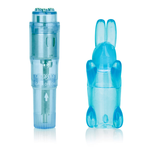 Blue pocket mini massager with bunny sleeve positioned on clean white surface.