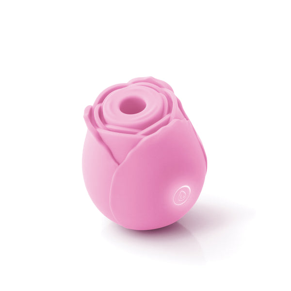 Pink rose-shaped suction vibrator displayed on white background.
