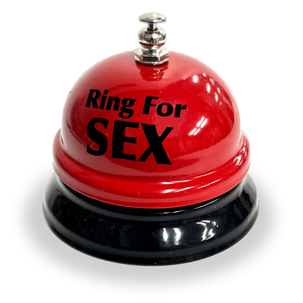 Small red desk bell with “Ring for Sex” label and chrome base on white background.